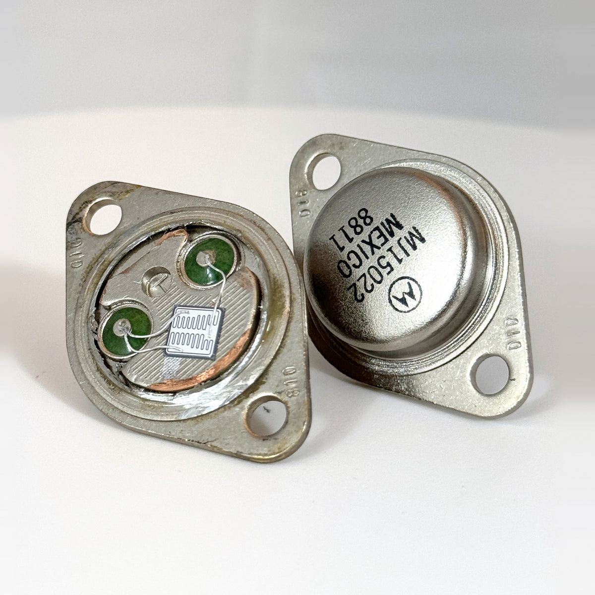 MJ15022 with the cap removed to show the genuine die, other angle